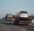 damaged-hatchback-car-loaded-emergency-tow-truck-repairs-roadside-assistance-hig